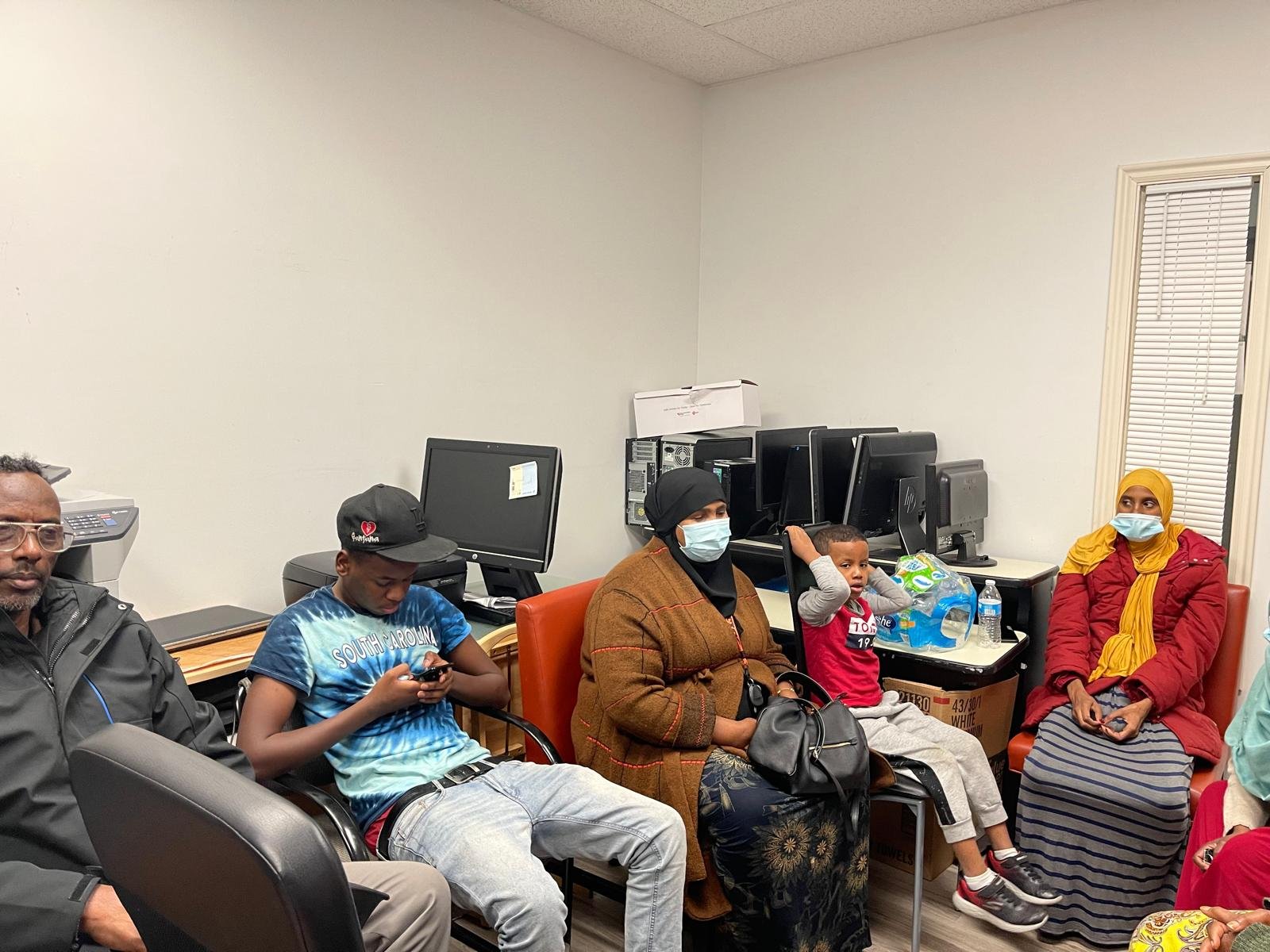 Visitors seated together in the office