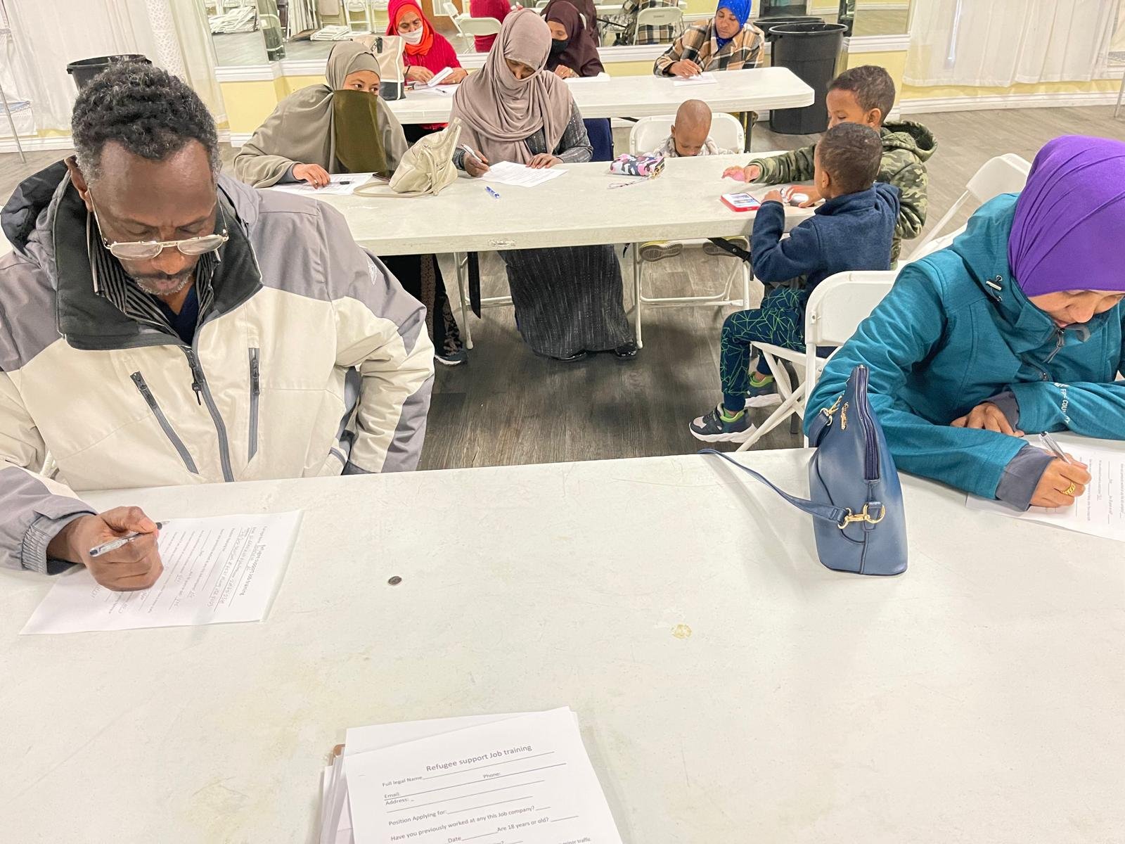 Families taking part in written activities together